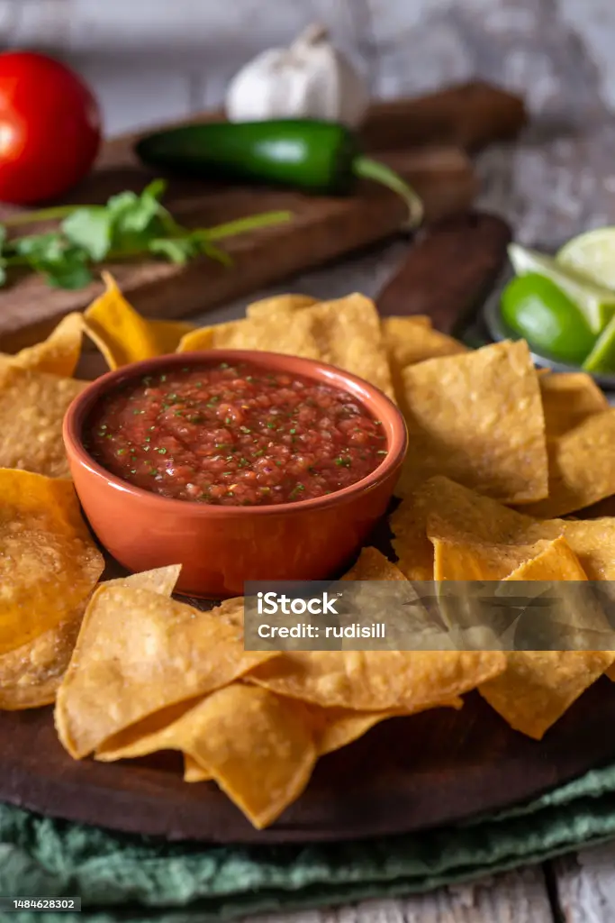 Fresh homemade salsa in a bowl with tortilla chips